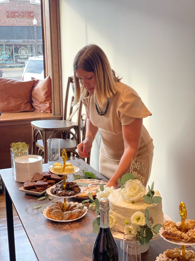 Wedding Planner Fixes Dessert Table At A Flint Hills Wedding Venue
